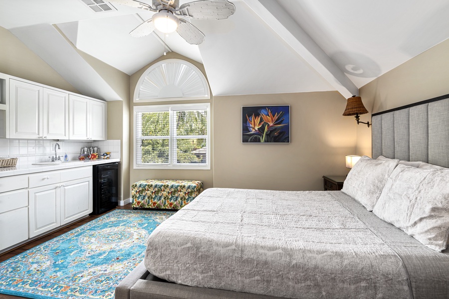Spacious guest room with King bed, central A/C, kitchenette, and vaulted ceilings