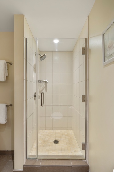 The third guest bathroom has a separate walk-in shower.
