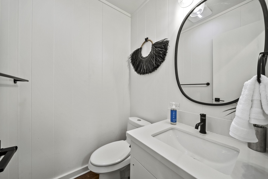 The bathroom featuring a sleek vanity and contemporary accents, ideal for freshening up between island outings.