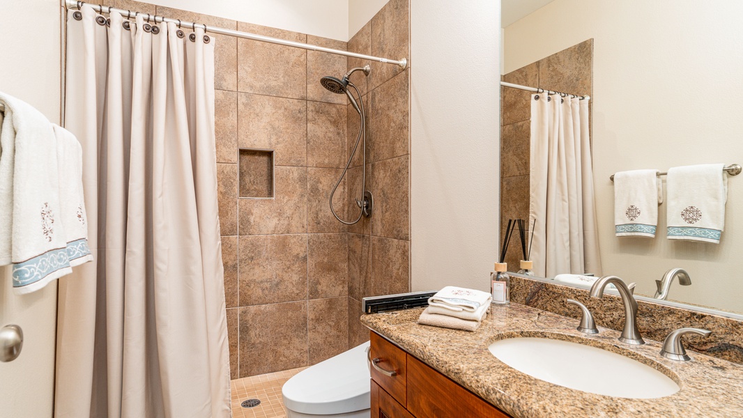 The full guest bathroom with a shower on the first floor.