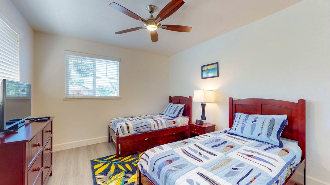 The third guest bedroom features twin beds and a trundle bed.