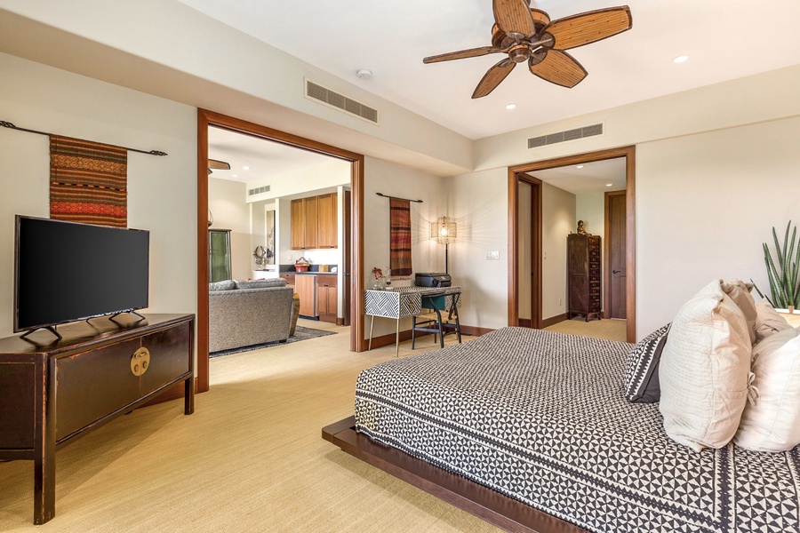 Alternate view of primary bedroom with sliding doors to bonus retreat room.