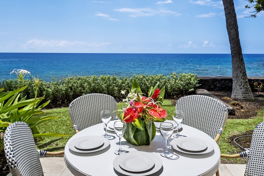 Dine al fresco on the shaded lanai, where ocean breezes and crashing waves set the perfect island mood.