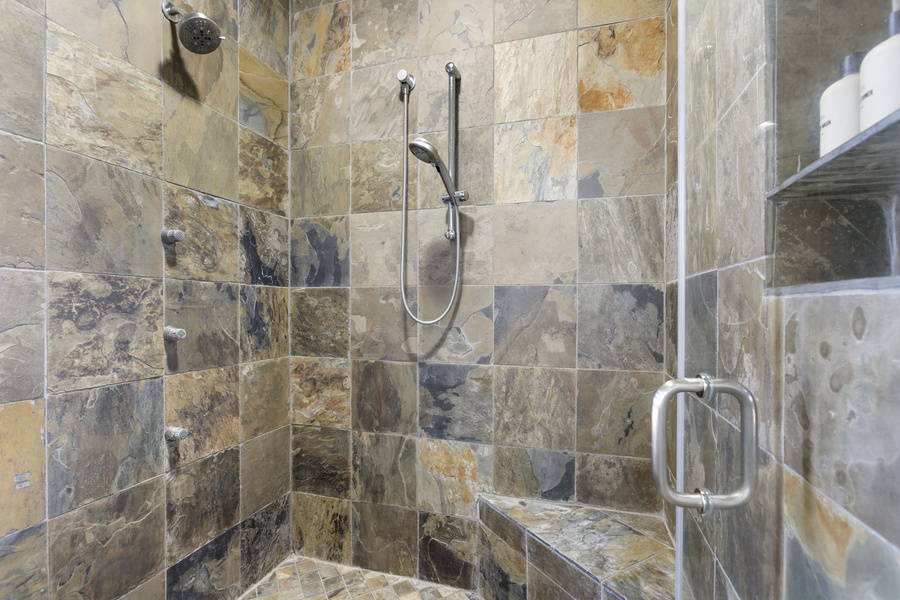 Walk-in shower with a glass enclosure