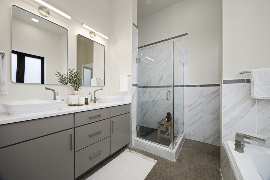 Spa-inspired ensuite with glass shower and modern finishes — a refreshing start or end to the day.