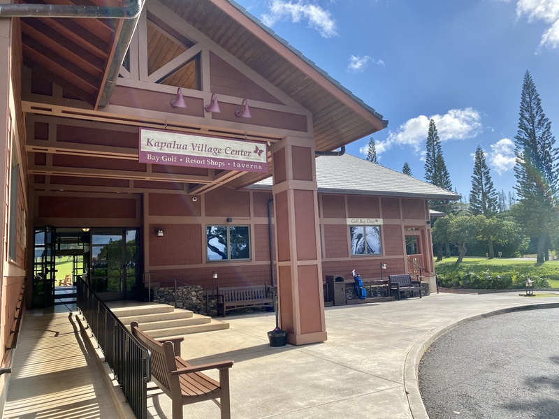 Spacious community center entrance, offering a welcoming atmosphere under a clear sky.