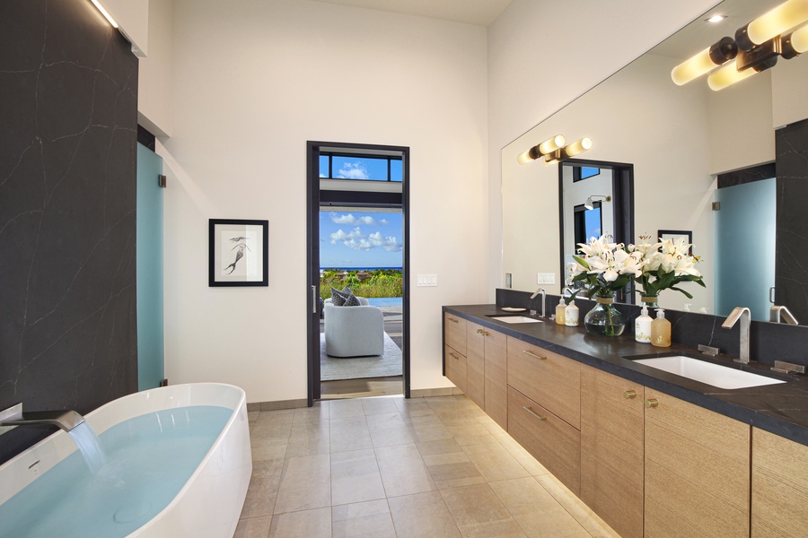 Relax and unwind in luxury with this stunning ensuite bathroom featuring a hot tub and shower.