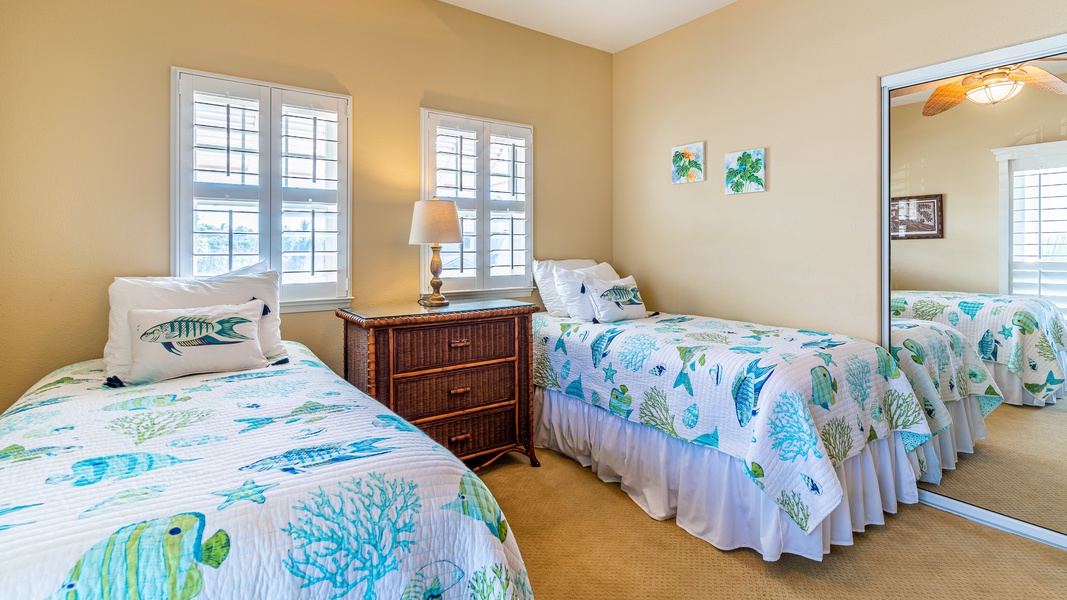 The third guest bedroom upstairs with twin beds and ocean decor.