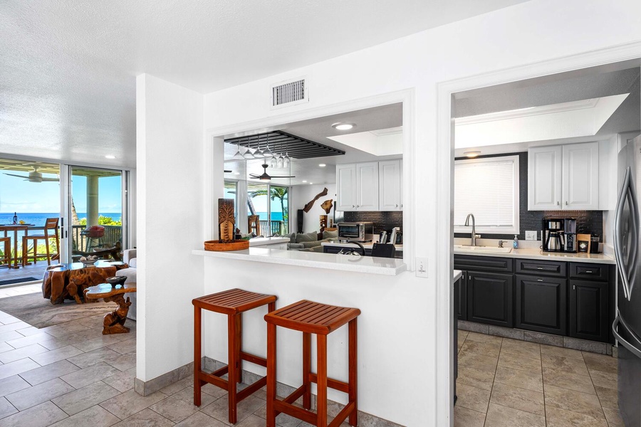 The updated kitchen has breakfast bar seating to visit with the Chef!