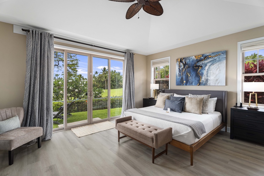 The primary suite wakes up to garden light through a full wall of windows.