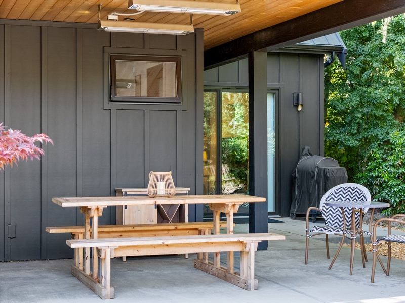 A cozy corner under the overhang, perfect for coffee or evening chats.