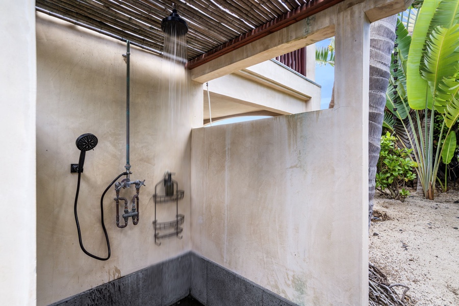 Rustic-chic outdoor rinse area with dual heads—ideal for returning from the beach or pool with ease.