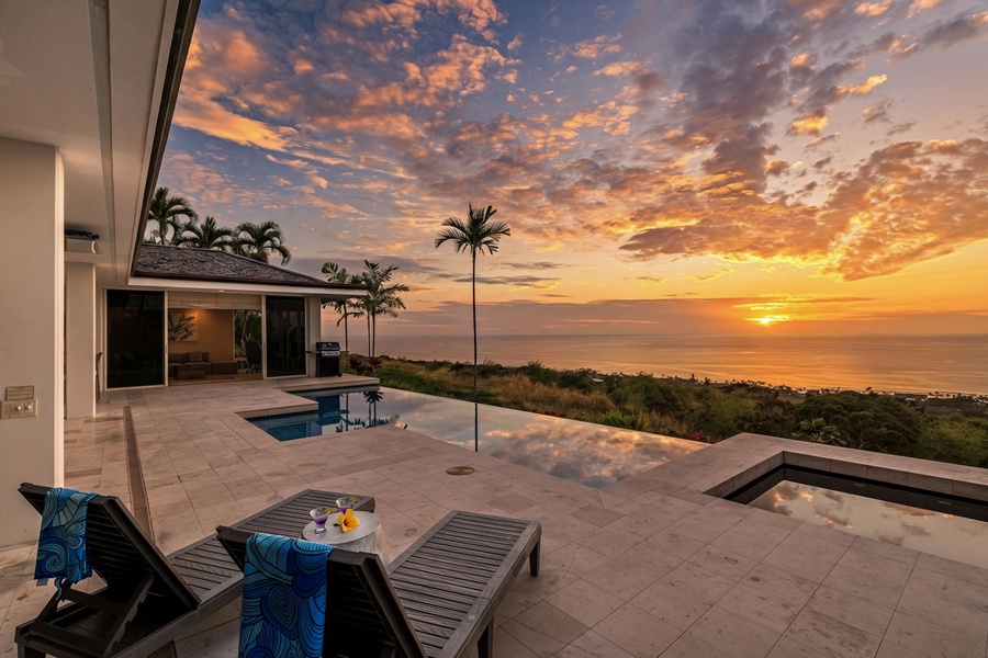Lounge poolside with a drink in hand as the sun sets over the ocean—paradise, just steps from your door.