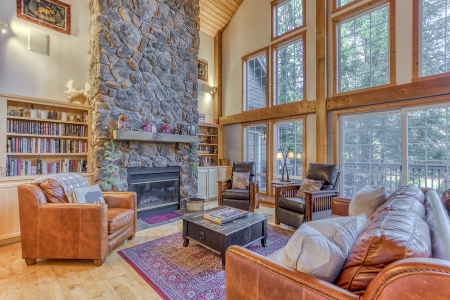 Gather around the cozy fireplace where additional seating creates an ideal spot for connecting and sharing stories.