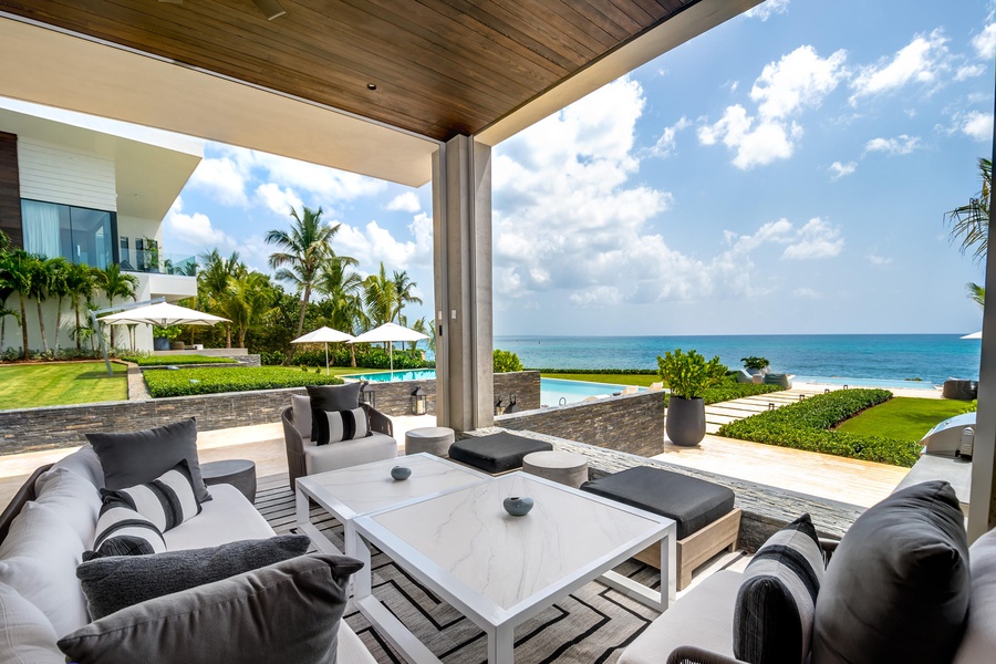 Shaded outdoor seating area, perfectly situated for breathtaking ocean views.