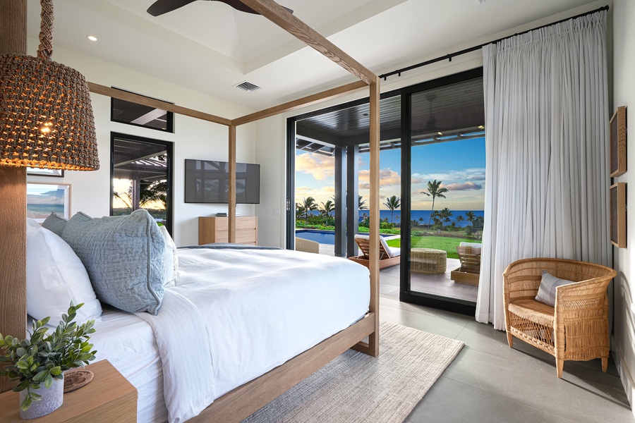 Wake up to breathtaking ocean views from this serene second bedroom with a king-size bed.