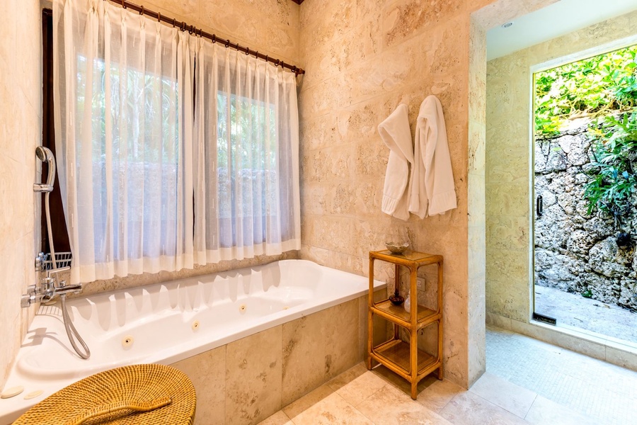 Soak up and relax in the tub of the spa like ensuite bathroom.