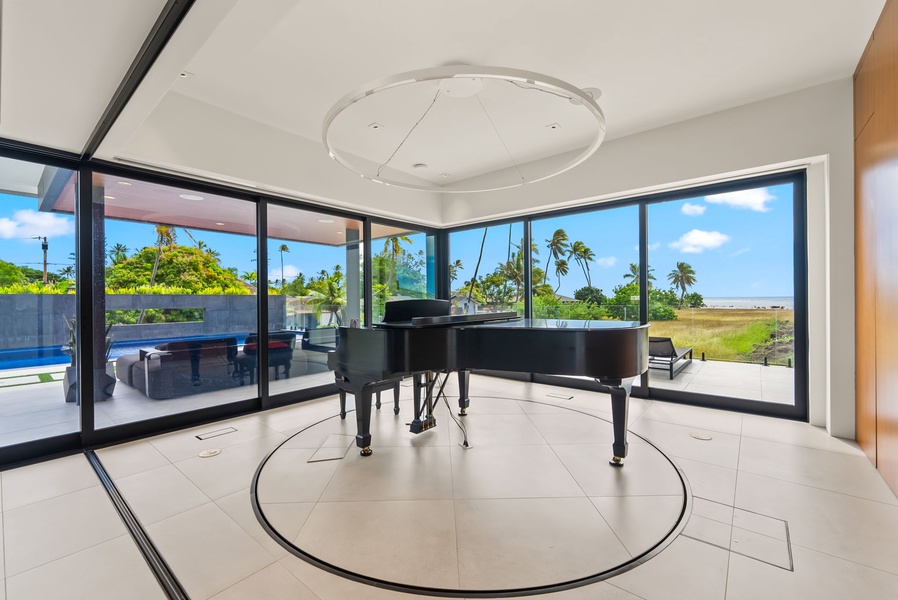 Thoughtful design allows for a light-filled music room with a grand piano and sweeping coastal views.