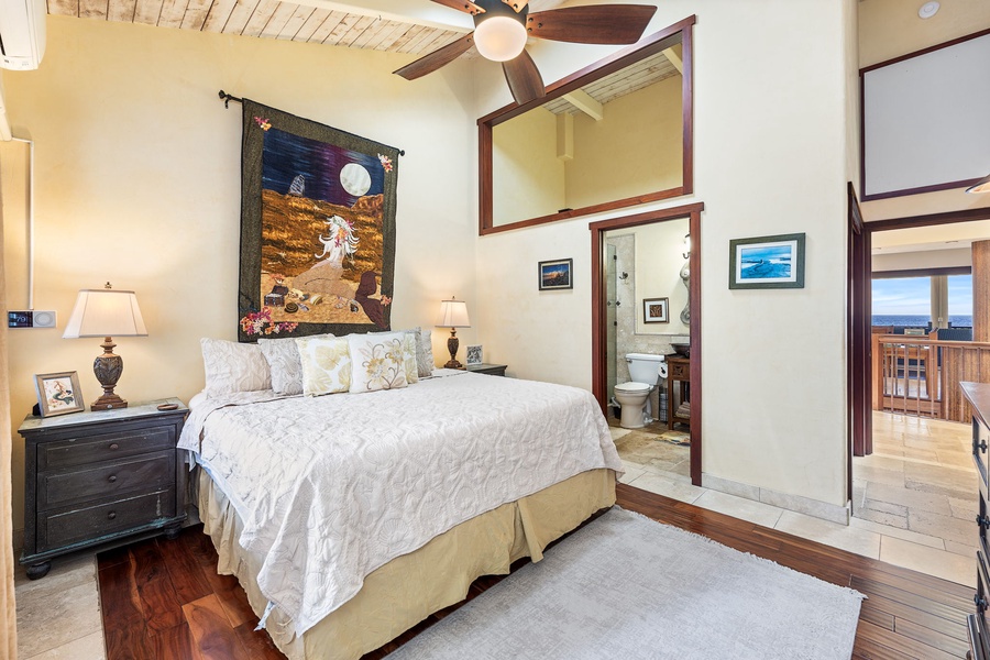 King guest suite with ceiling fan, plush linens, and charming Hawaiian touches—cozy yet elegant.