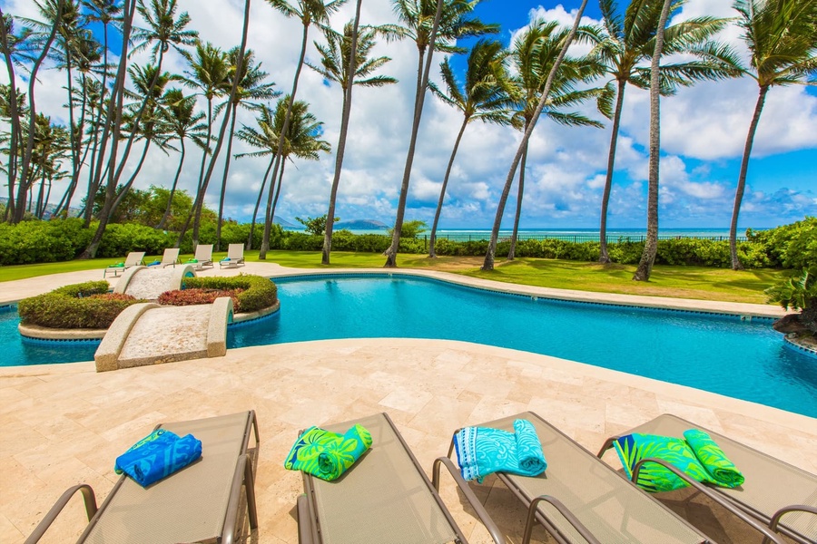 Unwind on your private pool deck surrounded by swaying palms