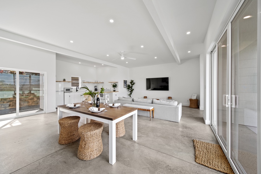 The sleek dining area has seating for four with direct lanai access for alfresco dining.