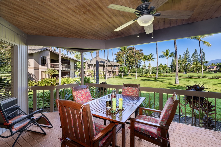 Enjoy your morning coffee on this covered lanai overlooking lush tropical gardens and swaying palms.