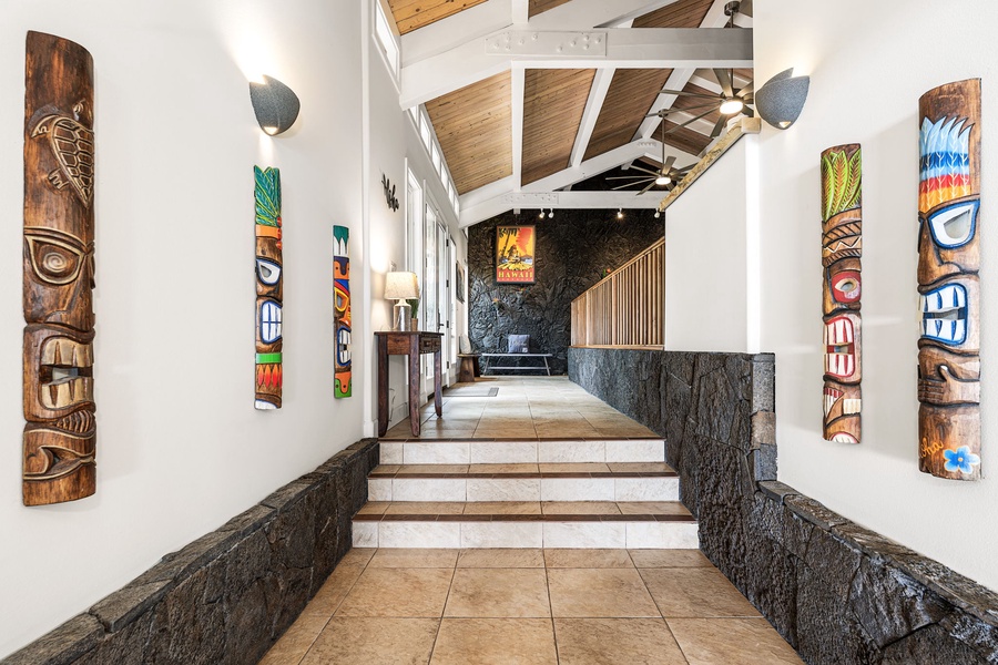 Arrive through a striking entry, where island textures and design set the tone.
