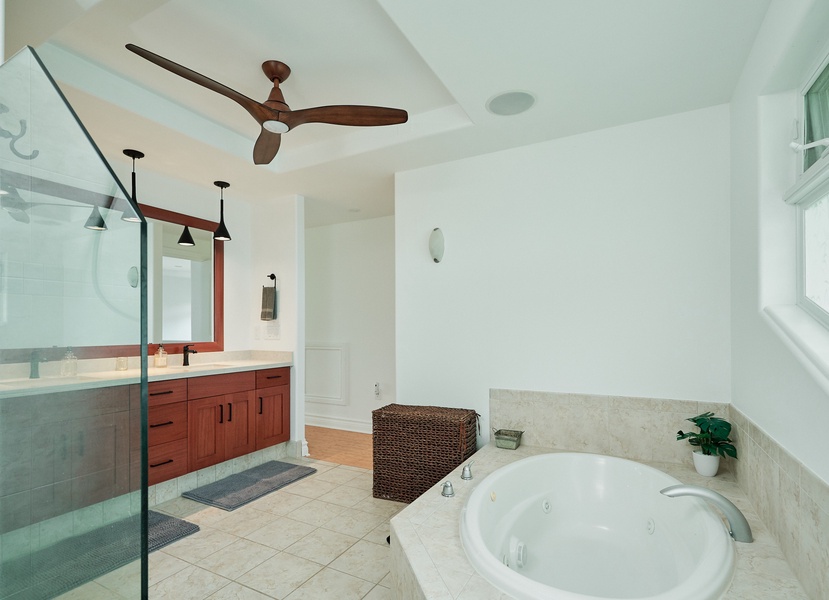 Indulge in your private spa-like bathroom featuring a luxurious soaking tub, walk-in shower, and elegant design details.