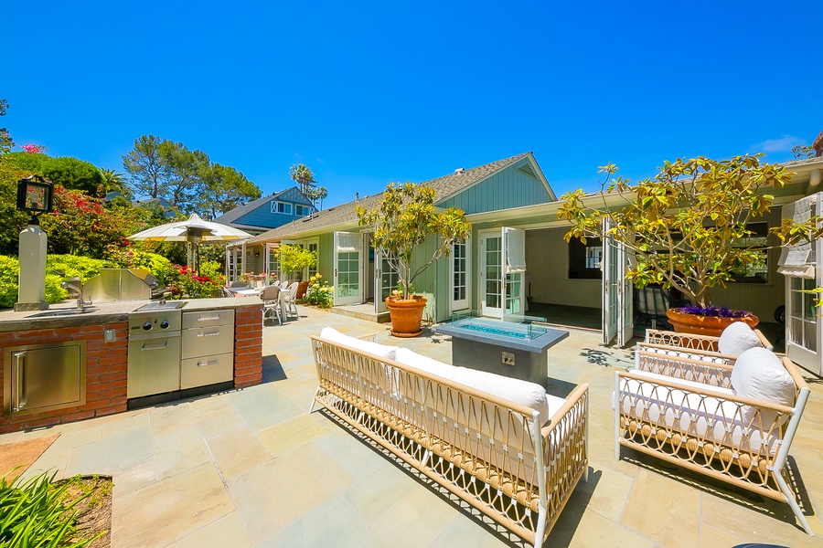 Back yard with firepit and outdoor kitchen