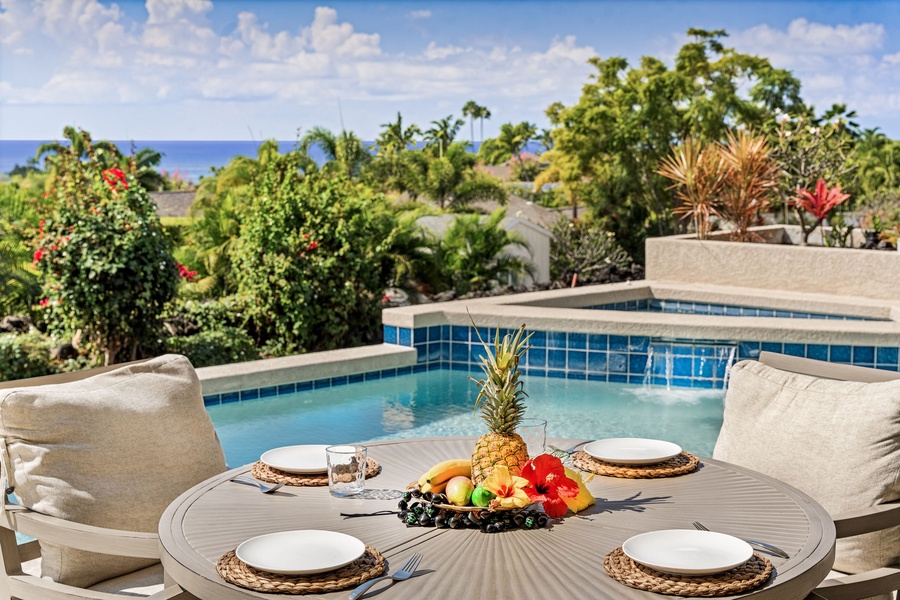 Outdoor dining area by the pool, perfect for tropical breakfasts or sunset dinners.