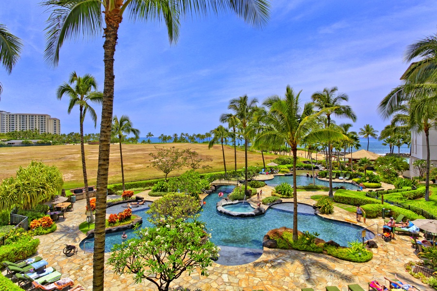 Take a dip in the pool, the lagoon or the sea under swaying palm trees.
