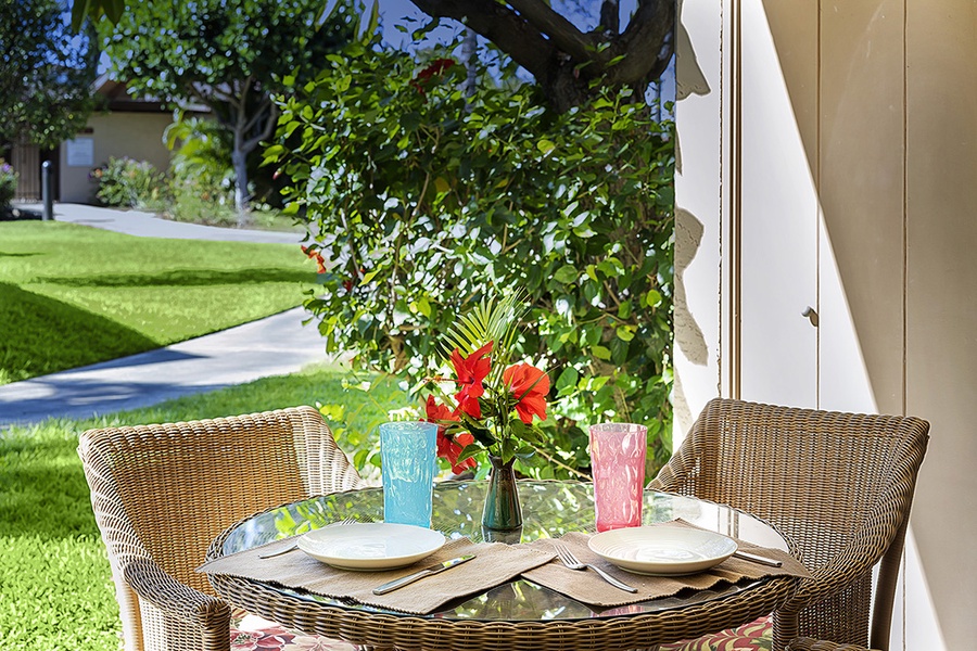Start your mornings in paradise with coffee on this charming lanai bistro set, surrounded by lush greenery.