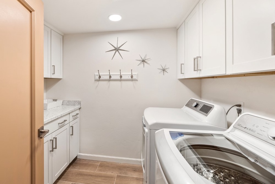 Laundry room with a washer and a dryer.