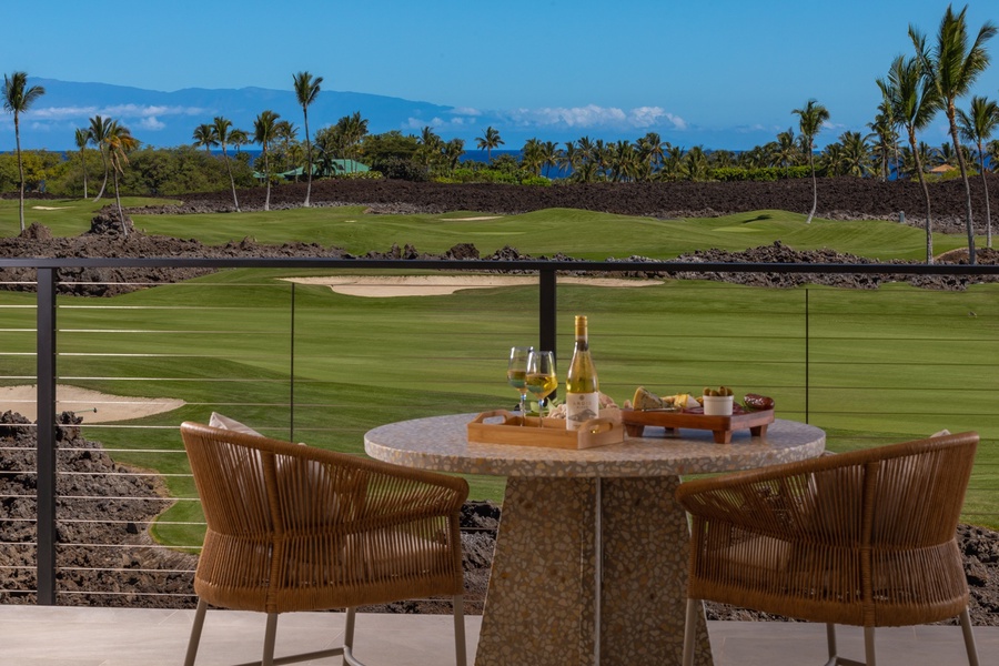 This inviting lanai located outside of the upstairs bedroom is perfectly positioned for enjoying scenic views of the golf course and distant mountains