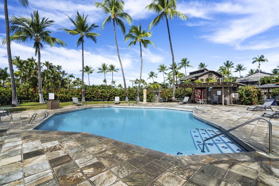 Tropical pool paradise with swaying palms creates your perfect Hawaiian escape beneath endless blue skies.