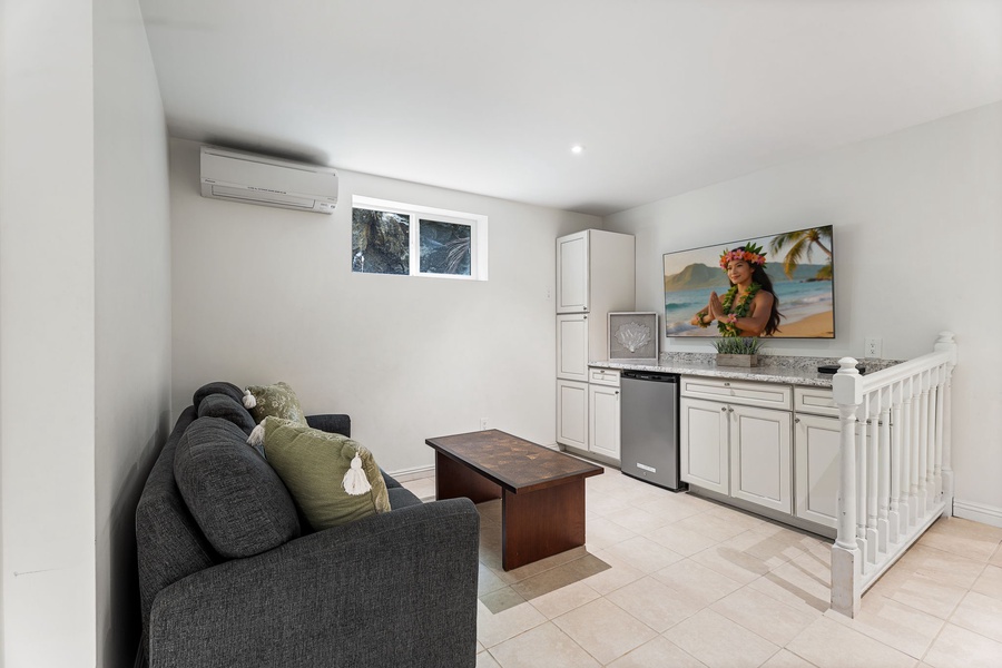 Your spacious lower-level retreat combines comfort with convenience - relax on the plush sleeper sofa while enjoying full kitchen amenities.