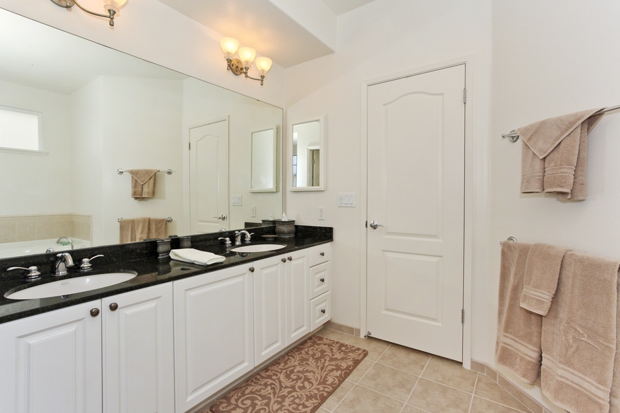 The primary guest bathroom with a large double vanity.