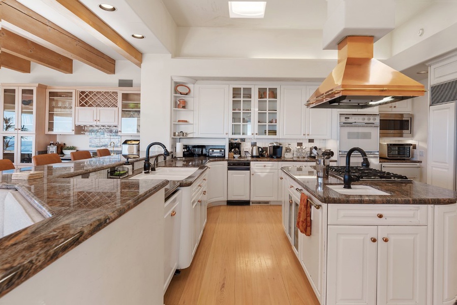 There is also a breakfast nook, wet bar and wine fridge, while the granite counter surfaces perfectly compliment the natural stone flooring used throughout