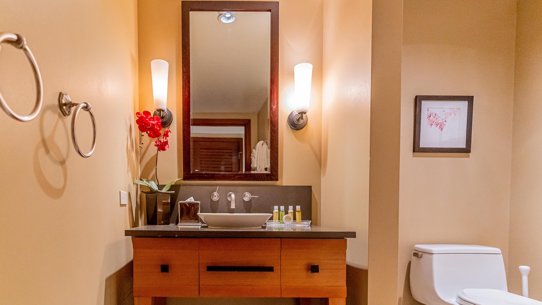 The second guest bathroom with warm wood tones.
