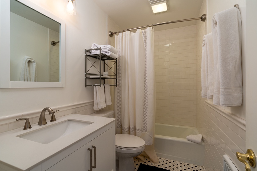 Guest bathroom offers a tub/shower combo