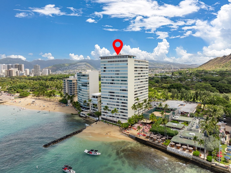 Aerial view of the beachfront condo with easy ocean access and proximity to city attractions.