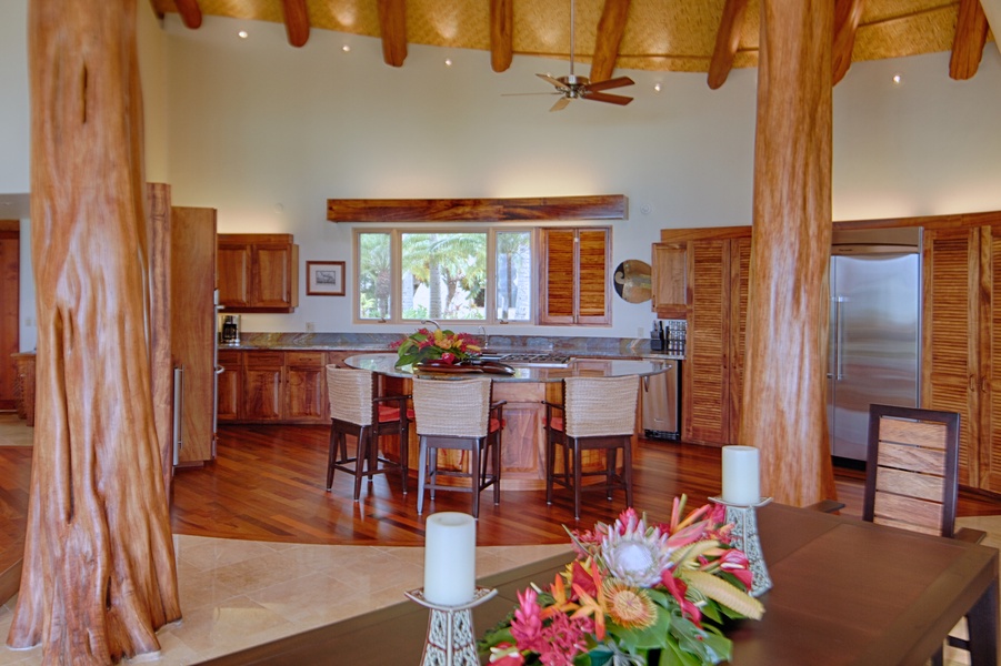 Kitchen framed by Ohia trees in Main House