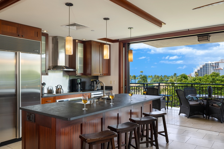 Cook in your gourmet kitchen while enjoying tropical views through floor-to-ceiling windows that open to your private balcony.