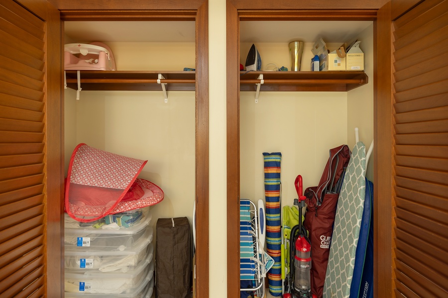 Well-organized closet storing beach and household essentials, with ample space for guest convenience.