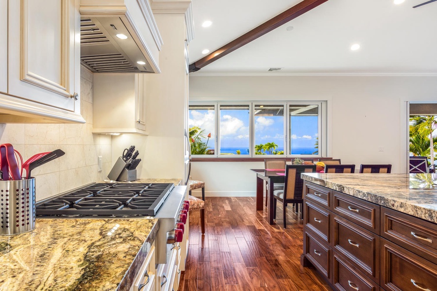 The kitchen is a chef's dream, fully equipped with integrated chef-style appliances and ample counter space