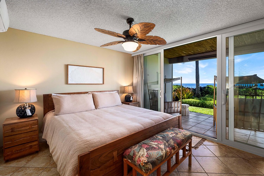 Plush king bed for the primary suite with access to the lanai