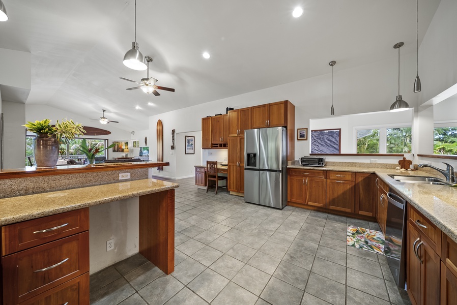 Kitchen-to-living flow with large island and easy access to outdoor spaces.