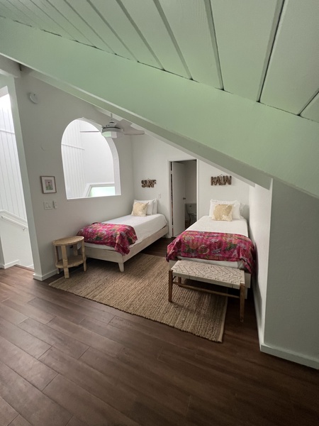 The loft bedroom contains two brand new Twin beds under a vaulted ceiling, as well as its own private fully remodeled bathroom
