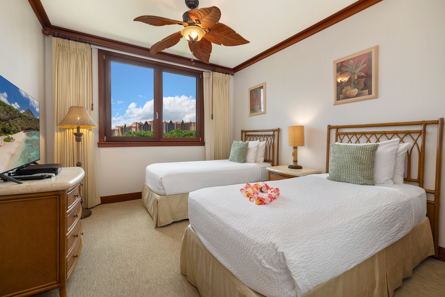 Drift off in your tropical-themed twin bedroom, where palm-leaf ceiling fans and Hawaiian touches create your island escape.