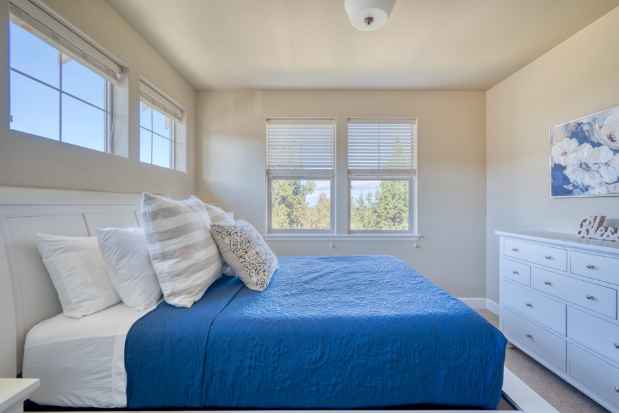 The third bedroom offers a Queen-sized bed, providing a spacious and cozy retreat for a restful night's sleep